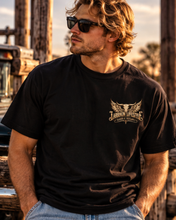 Load image into Gallery viewer, Saints &amp; Outlaws Ranch Standard Tee — back large skull wings
